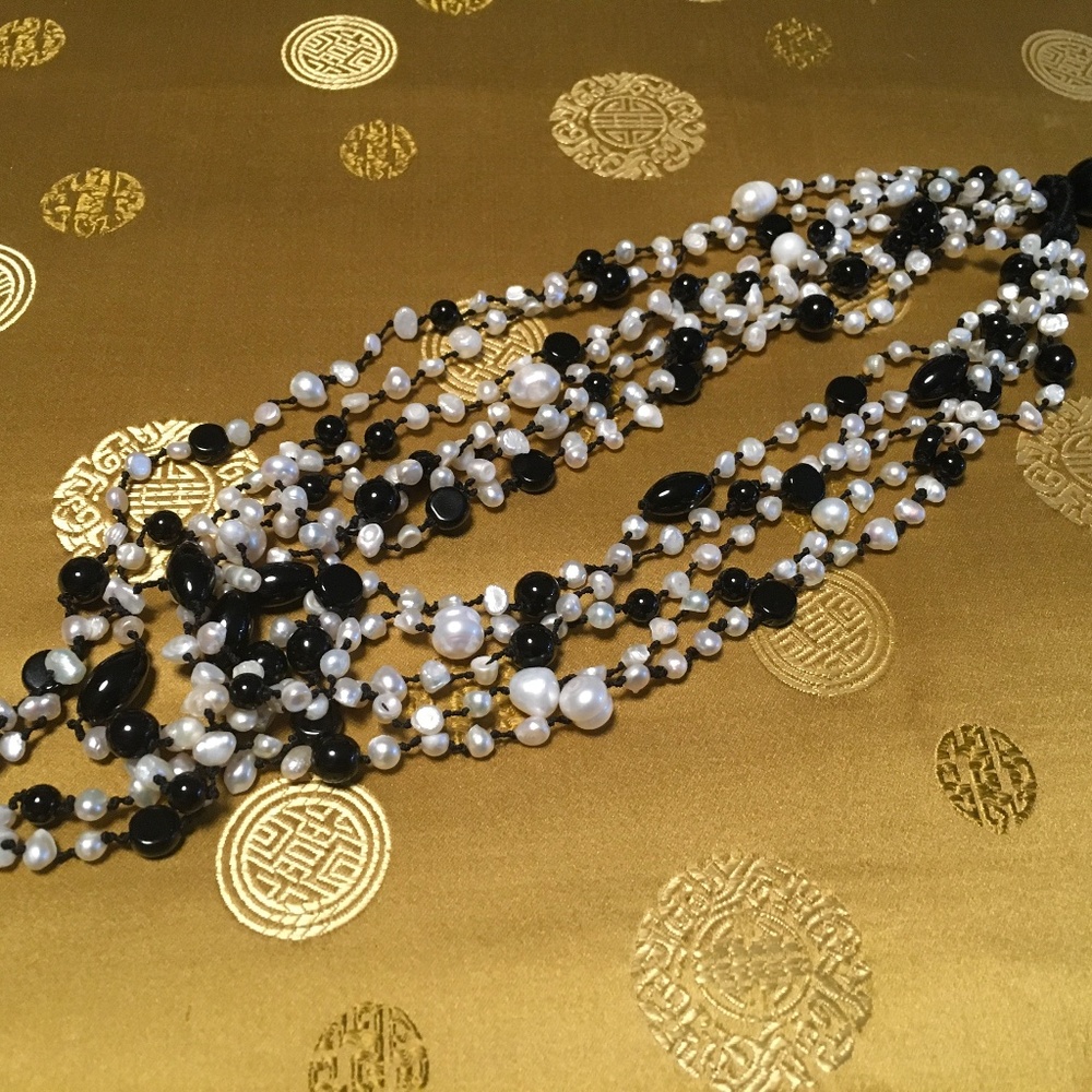 Pearl and black bead multi strand necklace